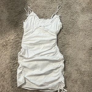 White tighter dress from Zara
